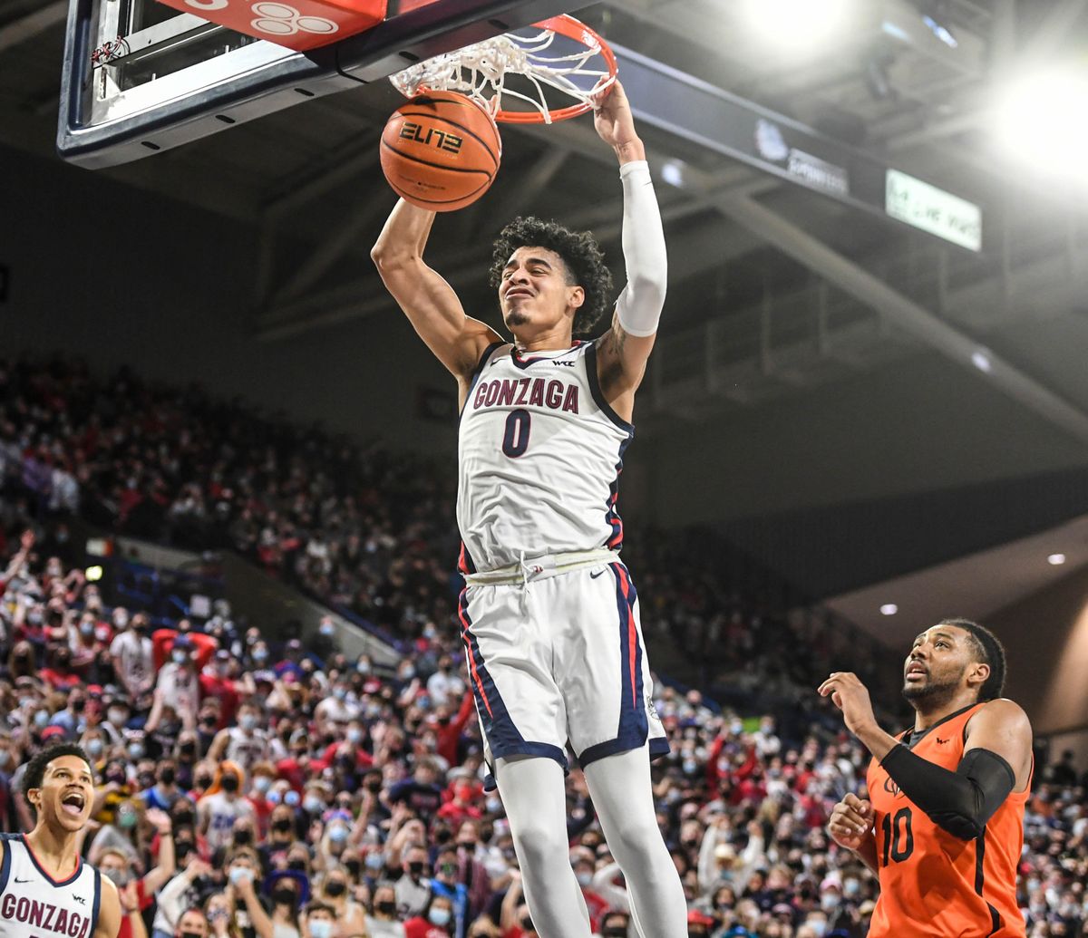 Gonzaga guard Julian Strawther slam over Pacific guard Alphonso Anderson, Thursday, Feb. 10, 2022 in the McCarthey Athletic Center.  (Dan Pelle/THE SPOKESMAN-REVIEW)
