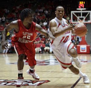 
New Mexico's Jamaal Smith, right, drives past Eastern Washington's Trey Gross on Monday in Albuquerque. Associated Press
 (Associated Press / The Spokesman-Review)