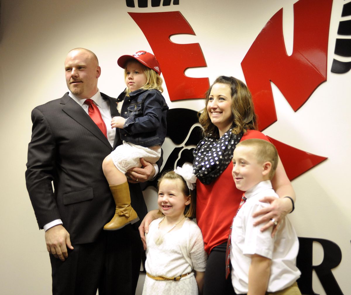 New Eastern Washington University Football Coach Aaron Best, left, poses for photos with his wife Kim, second from right, and their children Texis, 3, Tenli, 6, and Tank, 8 after Best was announced as the new football coach, Monday, Jan. 23, 2017 at EWU. (Jesse Tinsley / The Spokesman-Review)