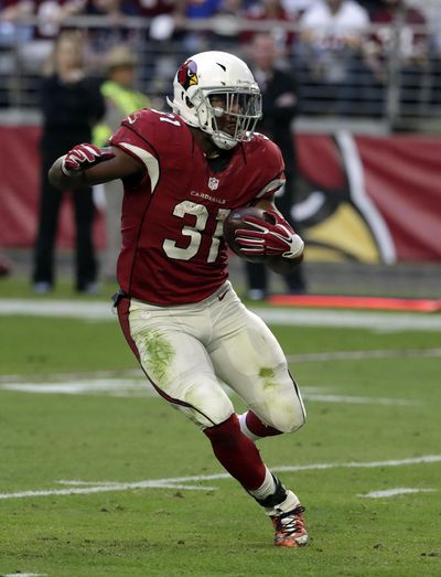 Arizona Cardinals running back David Johnson is attempting to become the third player in NFL history with 1,000 rushing yards and 1,000 receiving yards in the same season. (Rick Scuteri / Associated Press)