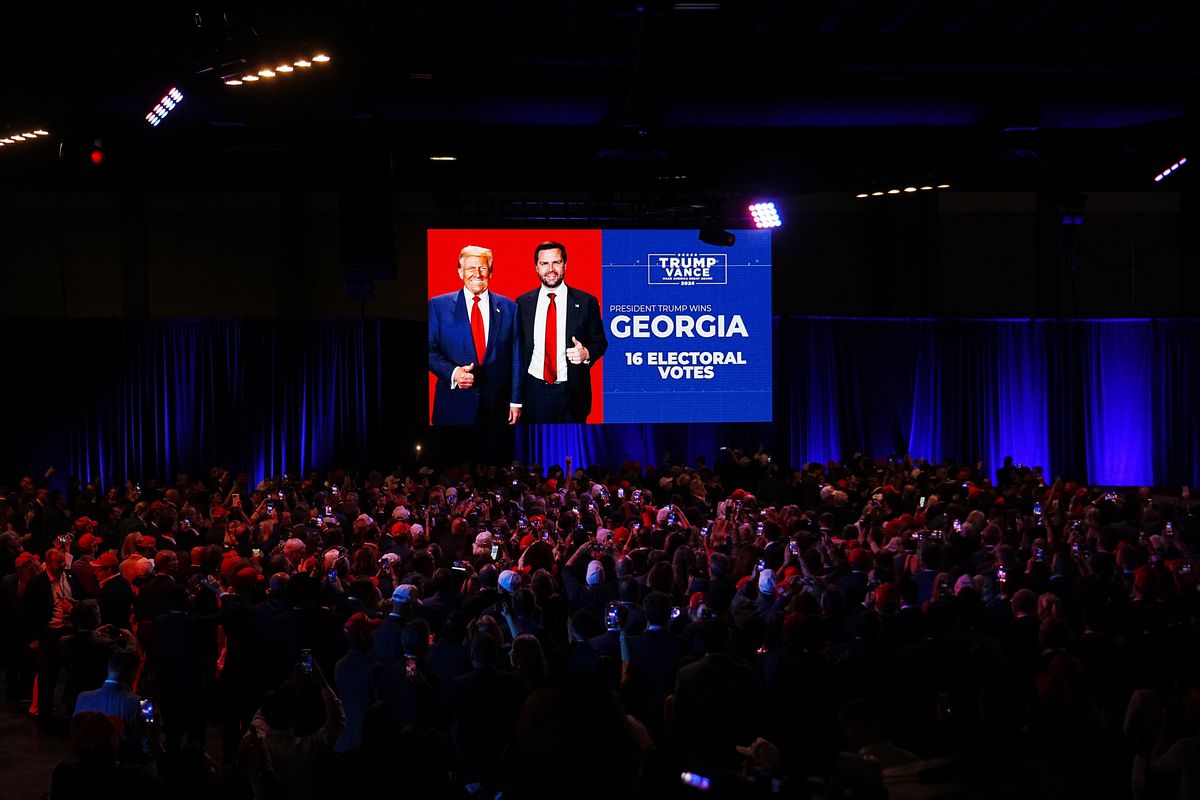 Supporters of former President Donald Trump, the Republican presidential nominee, watch as the campaign declares victory in Georgia at Trump’s election night event at the Palm Beach County Convention Center in West Palm Beach, Fla., on Tuesday, Nov. 5, 2024.  (Hiroko Masuike/The New York Times)