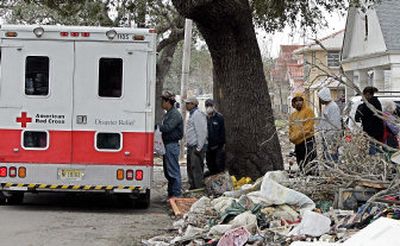 
People line up for food provided by the Red Cross in  New Orleans in December  2005.
 (File Associated Press / The Spokesman-Review)