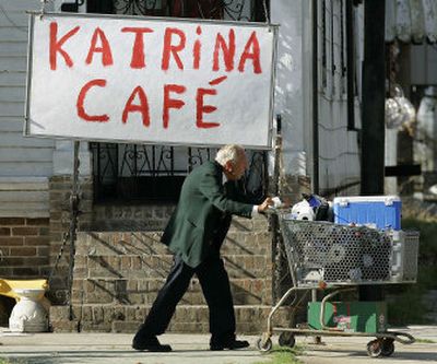 
Chuck Marshall pushes his cart Saturday on Canal Street in New Orleans. The elderly Marshall was headed to an automotive repair shop where he has lived since Hurricane Katrina hit. Disasters like Katrina can be especially hard on senior citizens.
 (Associated Press / The Spokesman-Review)