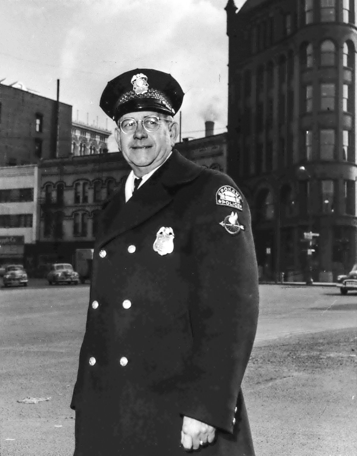 1952: A veteran of 28 years on the Spokane Police Department, Arthur Franklin Eslick stands at the intersection of Monroe Street and Riverside Avenue, where motorists remember him for his friendly smile and sense of humor. For 14 years he handled traffic at what he described as Spokane’s toughest traffic spot, the busy intersection at Main, Monroe and Riverside. Eslick died in 1963. (Jesse Tinsley/THE SPOKESMAN-REVIEW)
