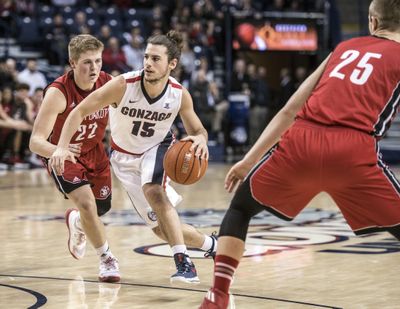 Gonzaga’s Rem Bakamus drives against South Dakota’s defense during a late-December game  in the McCarthey Athletic Center. (Dan Pelle / The Spokesman-Review)