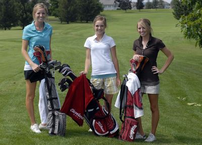 Sisters Mandy, Kaitlen and Haley Parsons pose at the first tee of Meadowwood Golf Course  July 1.  Mandy and Haley play for Washington State University and Kaitlen will be a junior  at University High School, having just finished fourth  in the state golf tourney. Their father, Casey, is a former Gonzaga University standout baseball player who played with the Spokane Indians and briefly with the Seattle Mariners. (J. Bart Rayniak / The Spokesman-Review)