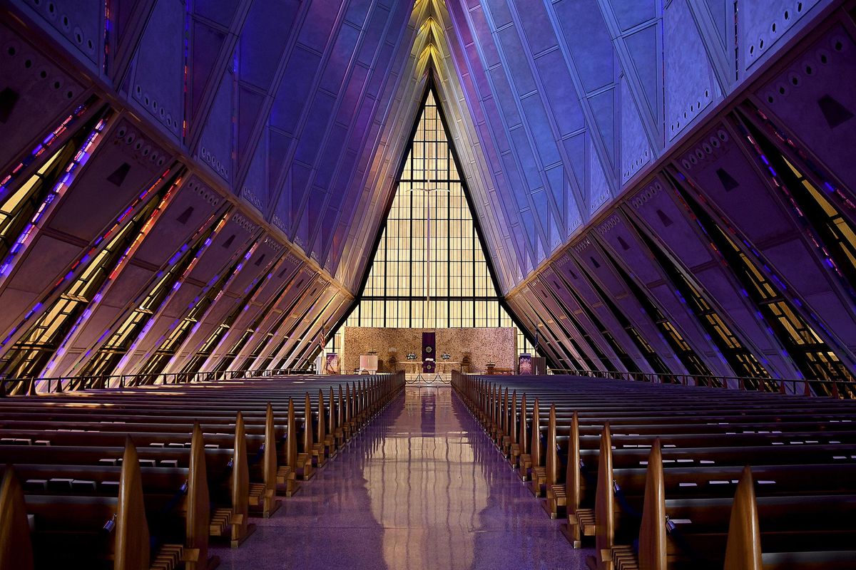 In this April 12, 2017, photo, light shines through the stained glass at the Cadet Chapel at the U.S. Air Force Academy outside Colorado Springs, Colo. The landmark Cadet Chapel is suffering from leaks and corrosion, so the school has drawn up the most ambitious restoration project in the buildings 55-year history. (AP Photo/Thomas Peipert) ORG XMIT: FX409 (Thomas Peipert / AP)