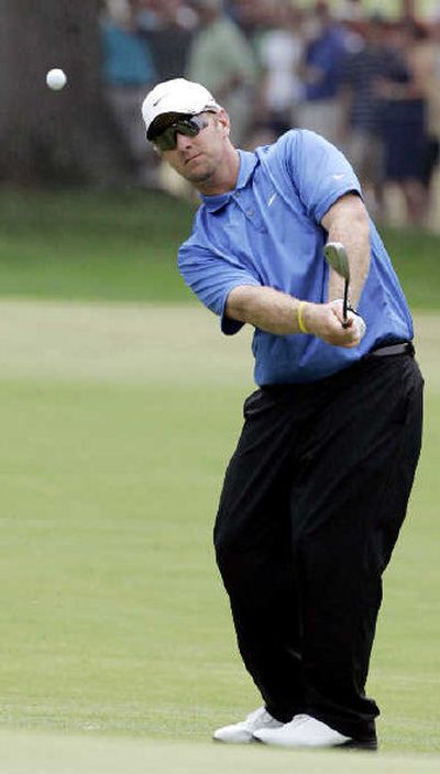 
David Duval chips on the second hole Saturday on the way to a round of 75.
 (Associated Press / The Spokesman-Review)