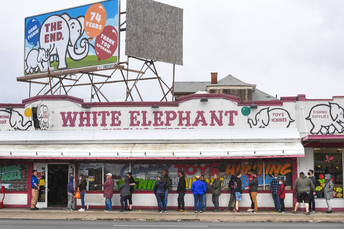 A line of customers await entering the White Elephant liquidation sale, Tuesday, June 9, 2020, on Division Street in Spokane, Wash. Dan Pelle/THE SPOKESMAN-REVIEW  (DAN PELLE)