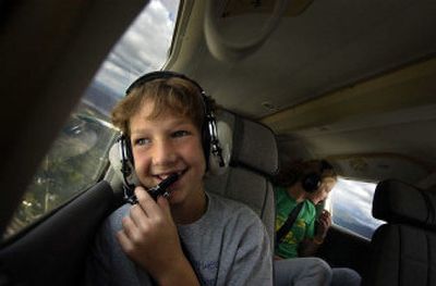 
Daniel Swanson, 12, takes a ride in a 1975 Viper Cherokee airplane Saturday. Swanson had a brain tumor but has been in remission for over four years. 
 (The Spokesman-Review)