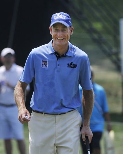 Jim Furyk is all smiles after shooting a second-round 4-under 66 at the Bridgestone Invitational golf tournament. (Associated Press)