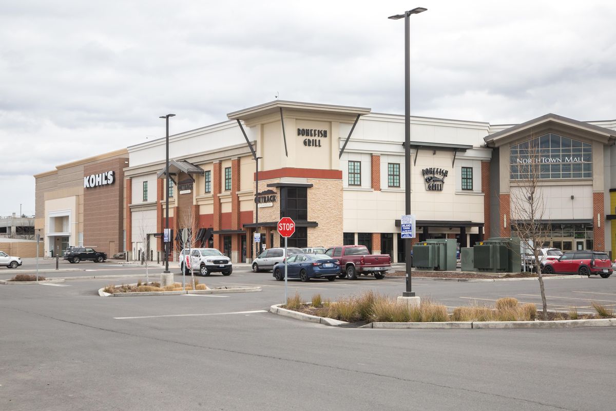 The parking lot of Northtown Mall is seen nearly empty during what would be normal business hours on the first full day of the “Stay Home, Stay Healthy” order on March 26, 2020 in Spokane. Washington state Gov. Jay Inslee announced new rules on Tuesay, May 19, 2020 that will qualify Spokane County to reopen retail stores. (Libby Kamrowski / The Spokesman-Review)
