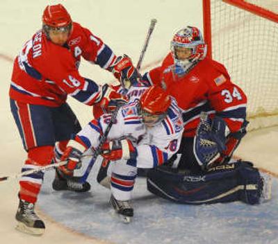 The Spokane Chiefs were stifling on defense on Sunday, as displayed here by goalie Dustin Tokarski and Jared Spurgeon.Special to 
 (Philip Walker Special to / The Spokesman-Review)