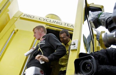 Italy’s Riccardo Ricco exits the Saunier Duval-Scott cycling team bus before being led away by French police.  (Associated Press / The Spokesman-Review)