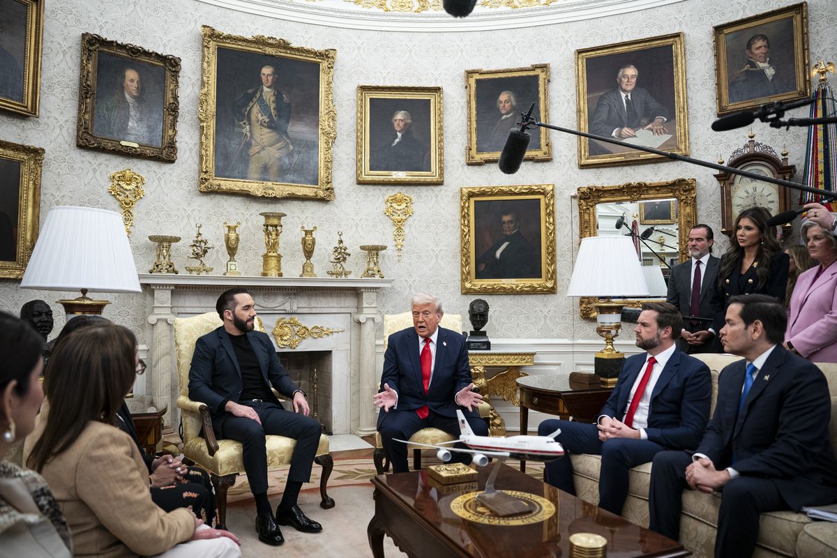 President Donald Trump, center, and El Salvadoran President Nayib Bukele, left, meet on April 14 in the Oval Office in the White House in Washington, D.C.  (Al Drago/For The Washington Post)