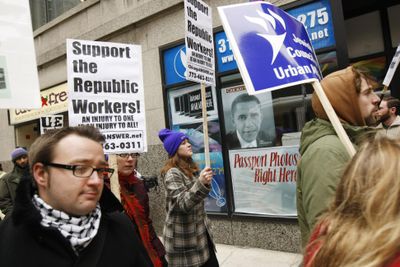Demonstrators march through downtown Chicago on Wednesday  in support of employees of the Republic Windows and Doors.  (Associated Press / The Spokesman-Review)