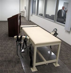 The execution chamber at the Idaho Maximum Security Institution is shown on Thursday, Oct. 20, 2011 as Security Institution Warden Randy Blades look on in Boise, Idaho. Paul Ezra Rhoades, who was convicted of killing three people in Idaho Falls and Blackfoot in 1988, is scheduled to be executed by lethal injection on Nov. 18, 2011. (AP / Jessie L. Bonner)