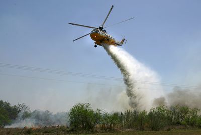 A Sikorsky S-61N chopper, like the one pictured here in March, was destroyed by fire after crashing  Tuesday in the Shasta-Trinity National Forest in California. Nine firefighters are presumed dead.  (File Associated Press / The Spokesman-Review)