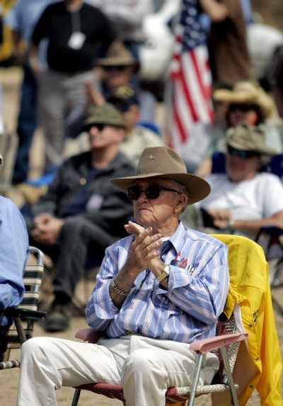 
Clyde Phillips claps during a Minuteman Project rally Saturday near Three Points, Ariz. 
 (Associated Press / The Spokesman-Review)