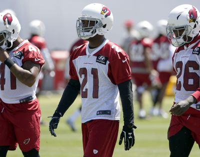 Arizona Cardinals’ Patrick Peterson (21) stretches during the NFL team’s organized team activity Wednesday, May 23, 2018, in Tempe, Ariz. (Matt York / AP)