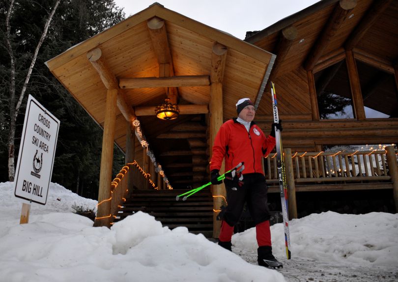 A nordic skier comes out of the Western Pleasure Guest Ranch lodge near Sandpoint. (Rich Landers)