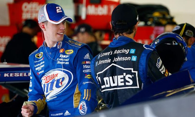 Brad Keselowski, driver of the #2 Miller Lite Dodge, talks with Jimmie Johnson, driver of the #48 Lowe's Chevrolet, in the garage during practice for the NASCAR Sprint Cup Series Sylvania 300 at New Hampshire Motor Speedway on September 22, 2012 in Loudon, New Hampshire. (Photo by Jared Wickerham/Getty Images for NASCAR) (Jared Wickerham / Getty Images North America)