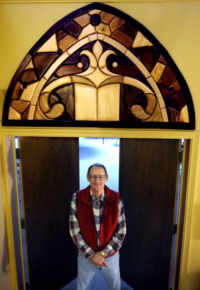 Bill Skelton talks about the  wooden hanging he made for St. Luke’s Church in Coeur d’Alene, on  March 24.  (Kathy Plonka / The Spokesman-Review)