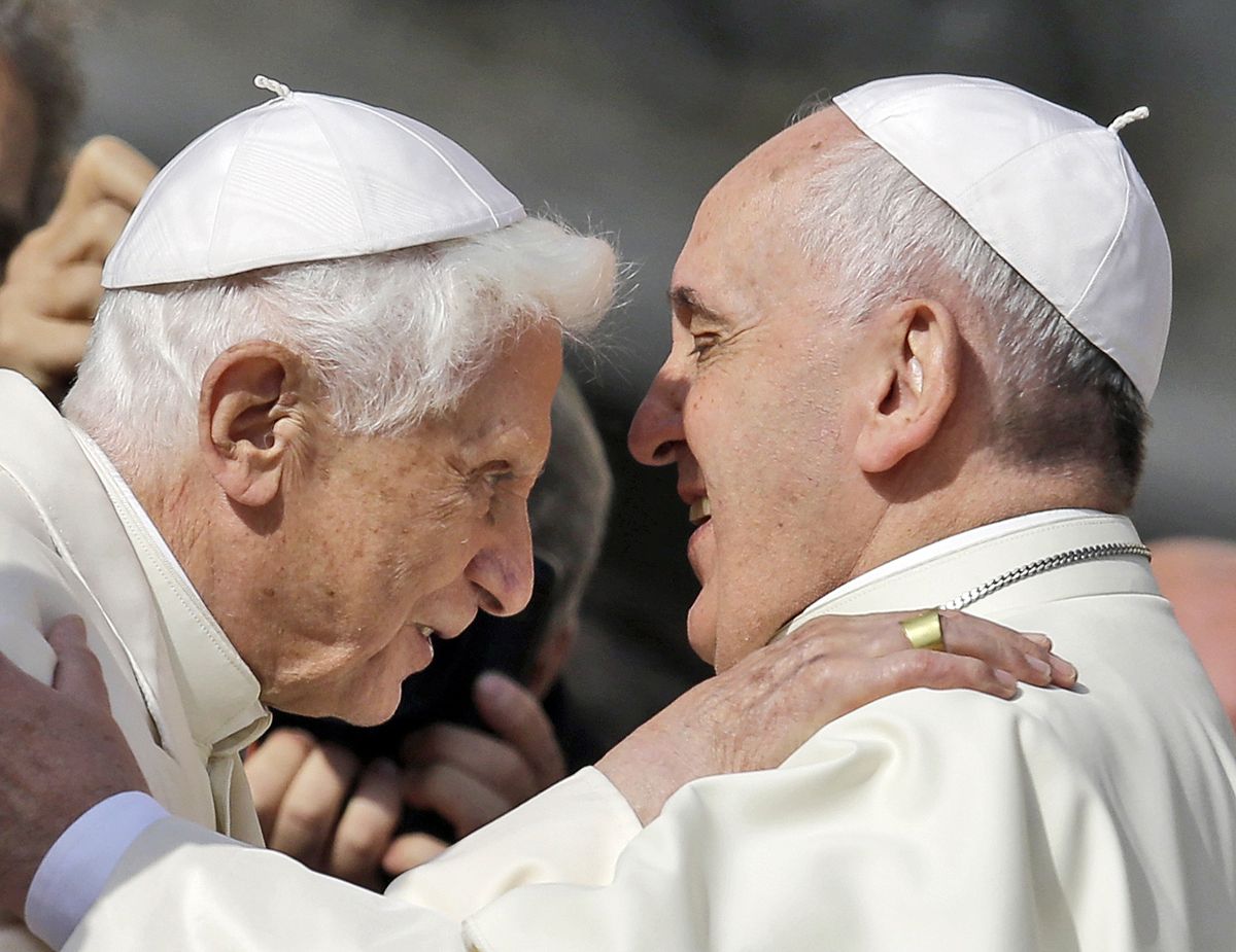 Pope Francis, right, hugs Pope Emeritus Benedict XVI prior to the start of a meeting with elderly faithful in St. Peter