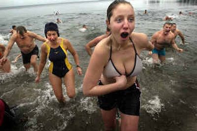 
Hundreds of brave swimmers took a midwinter dip in Lake Coeur d'Alene on a blustery 28-degree day at the annual Polar Bear Plunge on Saturday. 
 (Photos by Jed Conklin/ / The Spokesman-Review)