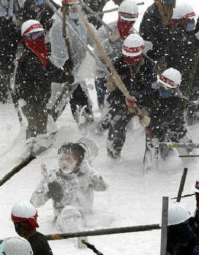 A South Korean police officer, bottom, is beaten by union members at a rally demanding better working conditions and limits on hiring short-term workers in Ulsan, south of Seoul, on Tuesday.
(Associated Press / The Spokesman-Review)