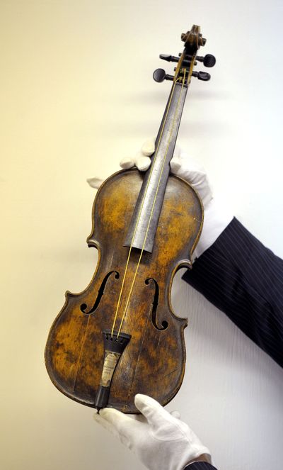 A violin believed to be the one played by the Titanic’s bandleader sold for $1.44 million Friday. (Associated Press)