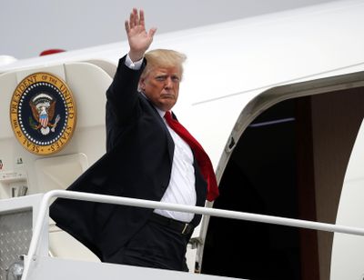 President Donald Trump waves as he boards Air Force One at Francis S. Gabreski Airport in Westhampton, N.Y., Friday, Aug. 17, 2018. Trump traveled to New York for a campaign fundraiser with supporters and is heading to Bedminster, N.J, to spend the weekend at his private golf resort. (Pablo Martinez Monsivais / Associated Press)
