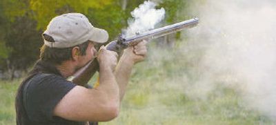 
Montanan Paul Degel fires his 54-caliber Leman Trade Rifle, a common flintlock from the 1800s. 
 (Associated Press / The Spokesman-Review)