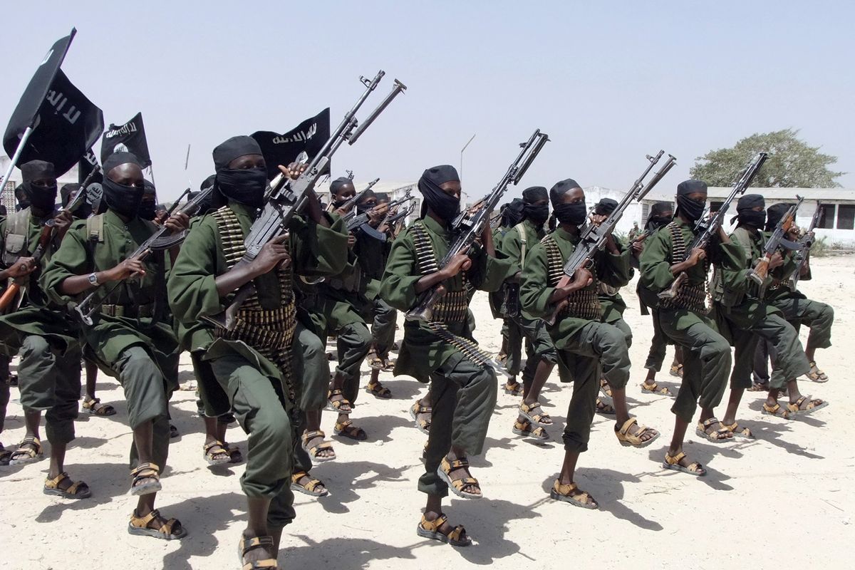 Hundreds of newly trained al-Shabab fighters perform military exercises near Mogadishu, Somalia, in February 2011. Navy SEALs carried out a predawn raid against a suspected al-Shabab leader Saturday in Somalia. (Associated Press)