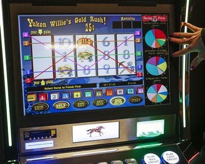 FILE - This March 5, 2015 file photo shows “instant racing” video gaming terminals at Les Bois Park in Garden City, Idaho. (Otto Kitsinger / AP)