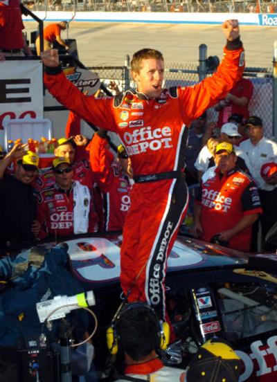 
Driver Carl Edwards celebrates in victory lane after winning the NASCAR Dodge Dealers 400 auto race. However, the joy could be short-lived after his car failed a post-race inspection by NASCAR officials. Associated Press
 (Associated Press / The Spokesman-Review)
