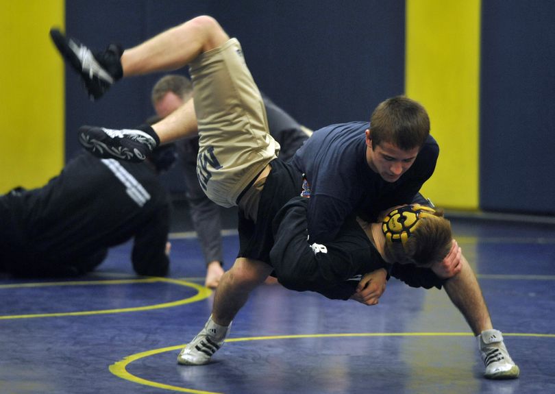 Mead wrestler, Jeremy Golding, takes down a teammate during practice. (Dan Pelle / The Spokesman-Review)