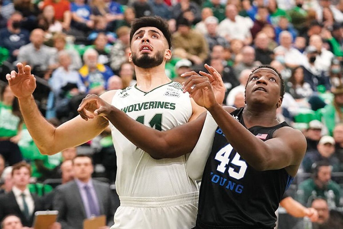 Utah Valley center Fardaws Aimaq (left) battles BYU