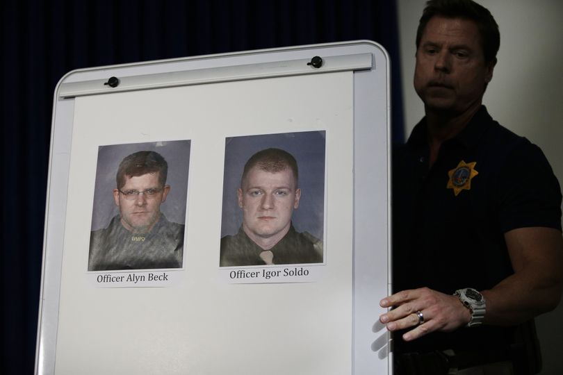 Pictures of Las Vegas Metropolitan Police Officers Alyn Beck, left, and Igor Soldo are seen a a news conference Sunday, June 8, 2014 in Las Vegas. The two officers were killed in an ambush while eating lunch. (John Locher / Associated Press)
