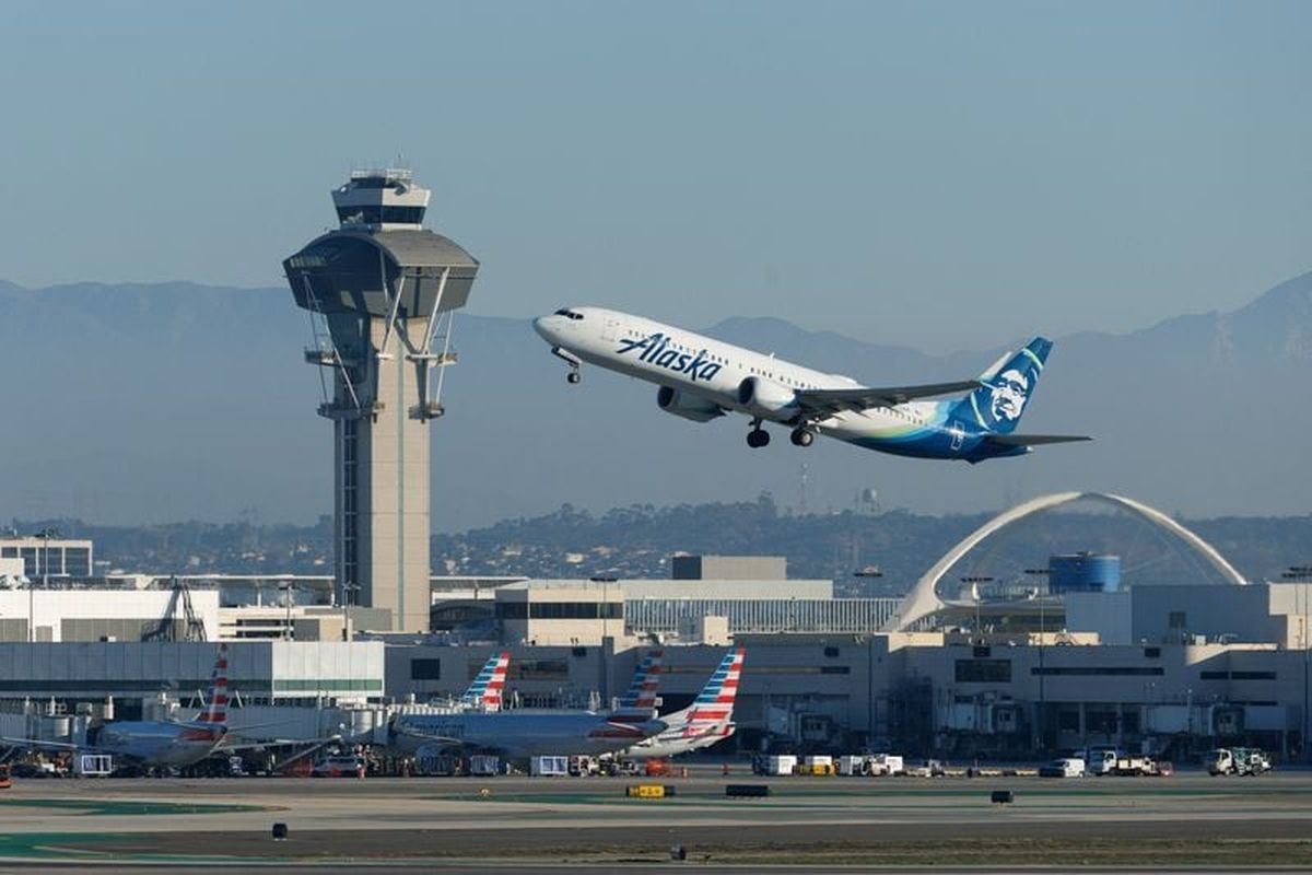 An Alaska Airlines commercial airliner takes off from Los Angeles International Airport on Nov. 6 in Los Angeles. (Mike Blake/Reuters)