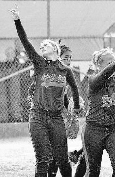 
Pitcher Samantha Skillingstad, left,  and teammates indicate two outs in the inning during an opener against Jackson at the 4A State tournament in Tacoma on Friday. Shadle won 5-0.
 (PATRICK HAGERTY / The Spokesman-Review)