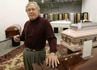 
Michael Rybarski, chief executive officer of TributeDirect, talks about some of the caskets and services the company offers over the Internet.
 (Associated Press / The Spokesman-Review)