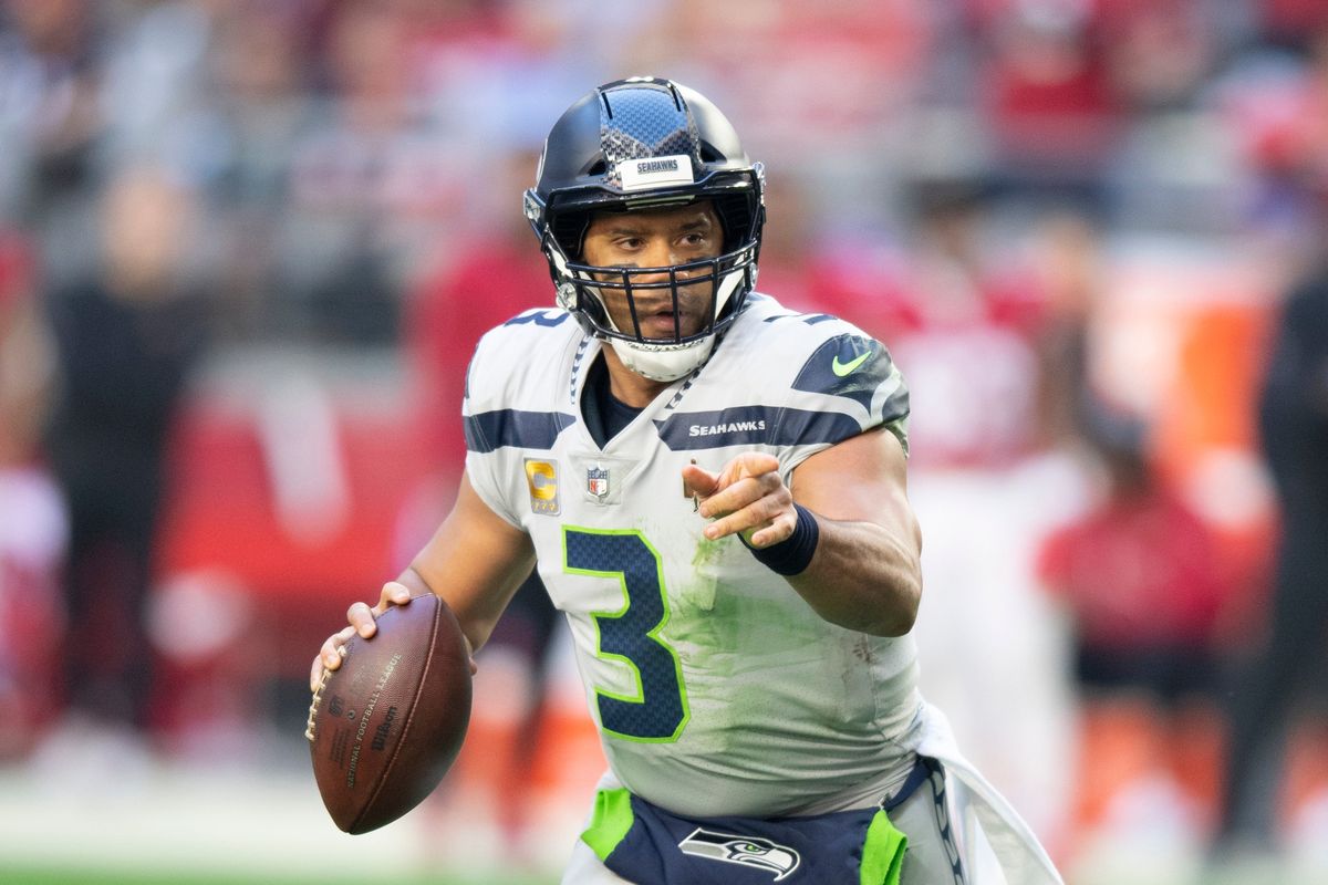 Seattle Seahawks quarterback Russell Wilson scrambles against the Arizona Cardinals during a football game on Jan. 9 in Phoenix. On Tuesday, the Seahawks agreed to trade Wilson to the Denver Broncos.  (Associated Press)