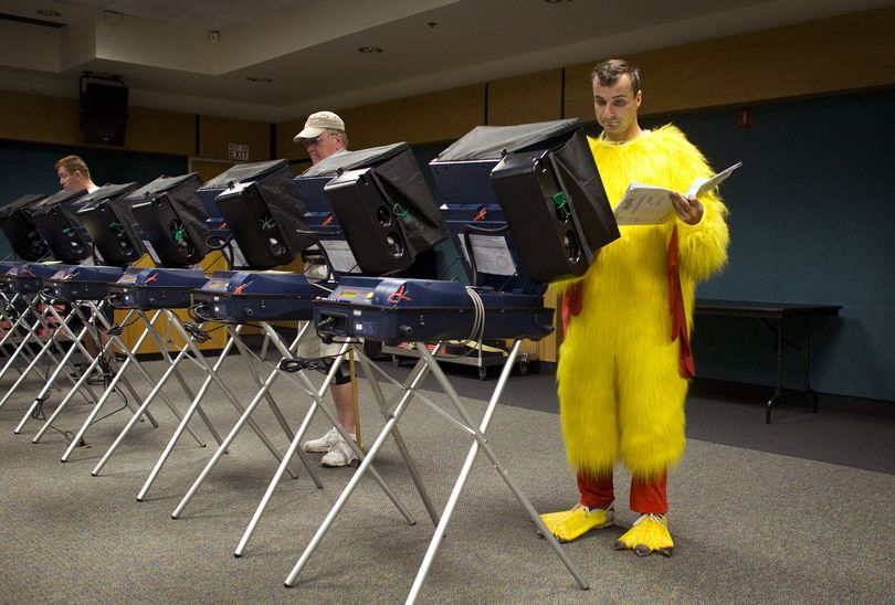 Michael Ginsburg, in chicken costume, votes in a primary election at the Rainbow Library in Las Vegas Wednesday, May 26, 2010. (John Locher / Las Vegas Review-journal)