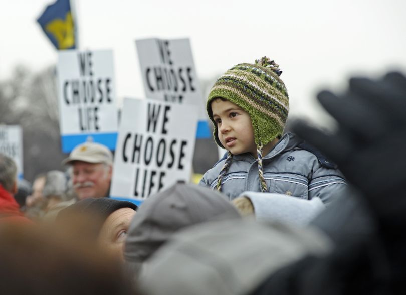 An unidentified boy waits for the start of the March for Life, Friday, Jan. 22,2010, in Washington. (Cliff Owen / Fr170079 Ap)