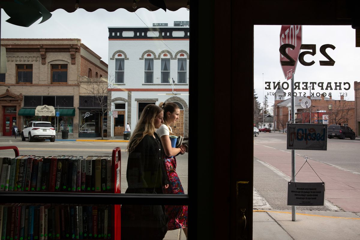 The windows of Chapter One Book Store look out onto West Main Street in downtown Hamilton, Montana. MUST CREDIT: Holly Pickett/For The Washington Post  (Holly Pickett/FTWP)