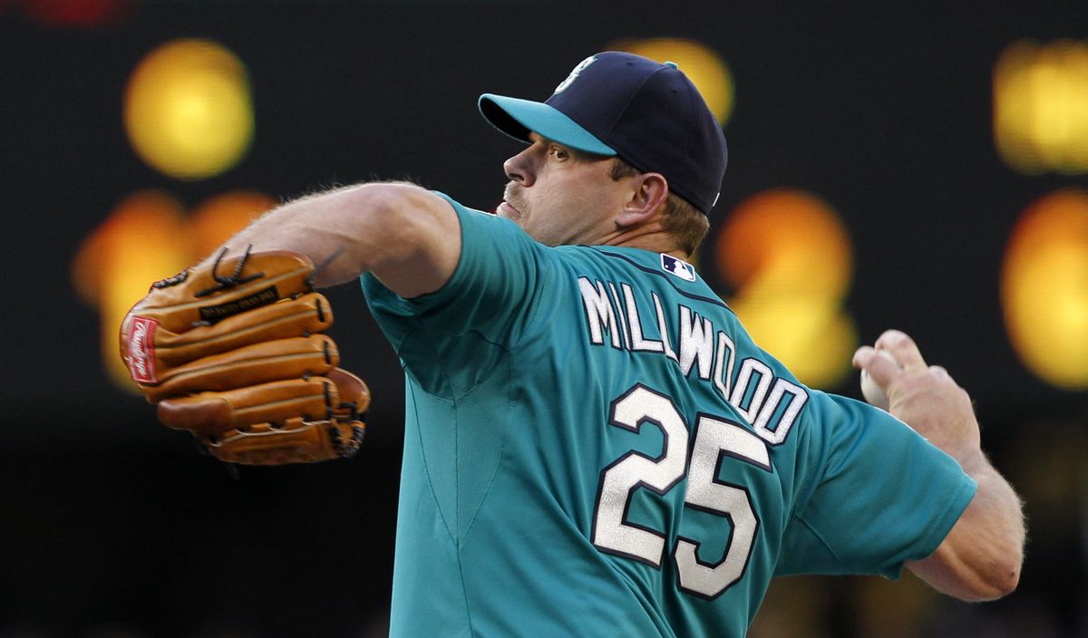 Seattle Mariners starting pitcher Kevin Millwood throws against the Los Angeles Dodgers in the first inning of a baseball game Friday, June 8, 2012, in Seattle.The Mariners won 1-0 in a six-pitcher combined no-hitter. (Elaine Thompson / Associated Press)