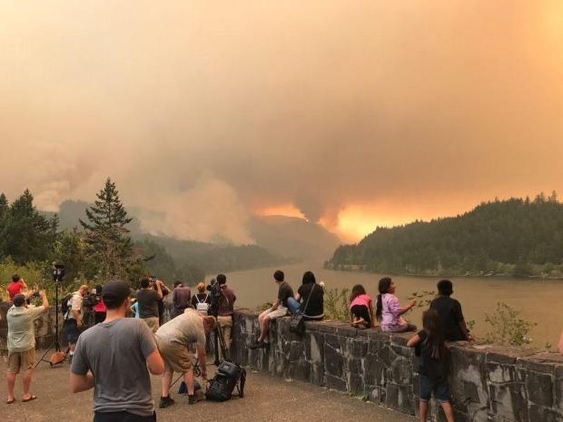 Onlookers watch the huge Eagle Creek Fire burn in the Columbia River Gorge in Oregon on Sept. 4, 2017; as of Tuesday, Sept. 26, the fire was only 46 percent contained. (Inciweb)
