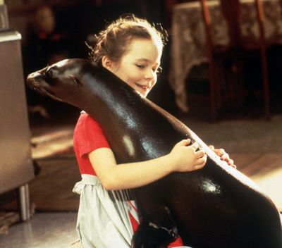 Toni Whitney, played by Tina Majorino, teaches Andre some remarkable tricks in this undated photo from Paramount Pictures film “Andre.” (JACK ROWAND / Associated Press)