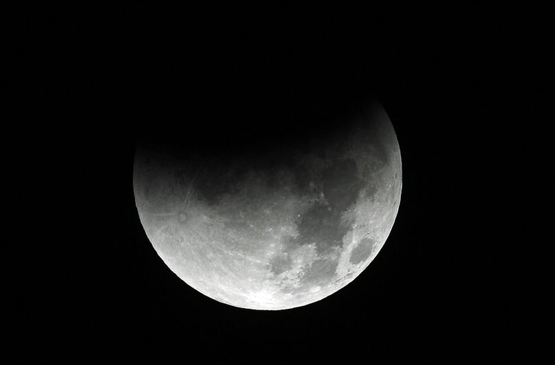 The Earth casts its shadow across the moon's surface during the lunar eclipse as seen from Portland, Ore., Saturday, Dec. 10, 2011. (Rick Bowmer / Associated Press)